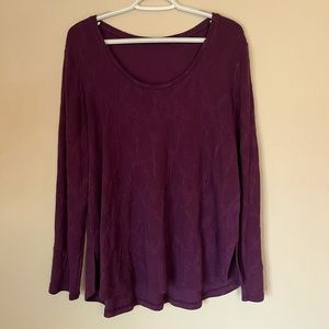 Soft textured knit tunic with round neck in rich eggplant.